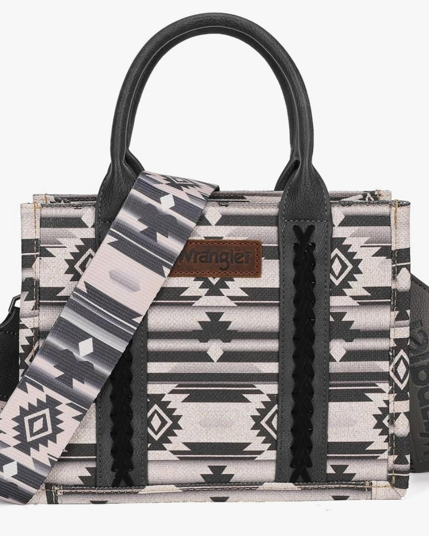 Black and ivory western print tote bag with black handles and a matching strap